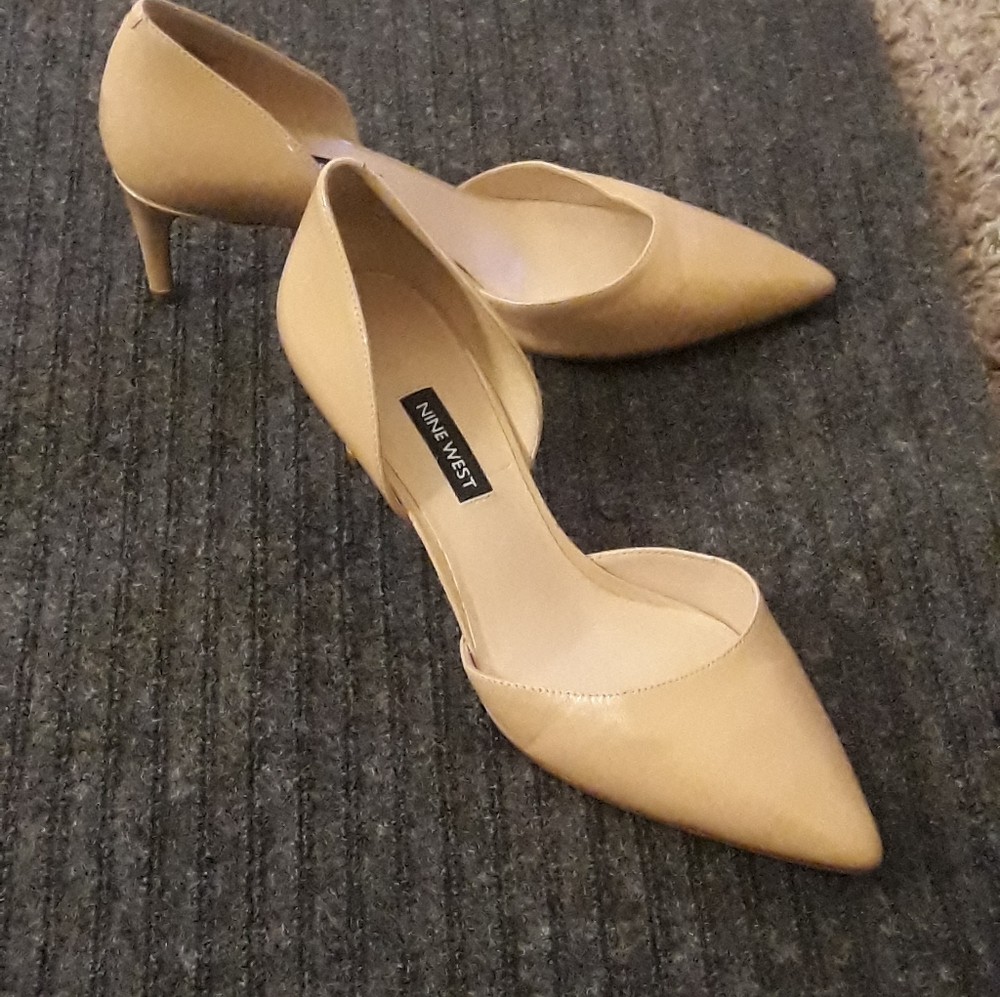 Nine West mid-heel nude pumps.